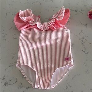 Rufflebutts Seersucker Scoopback Ruffle One Piece Swimsuit Pink and white 2T